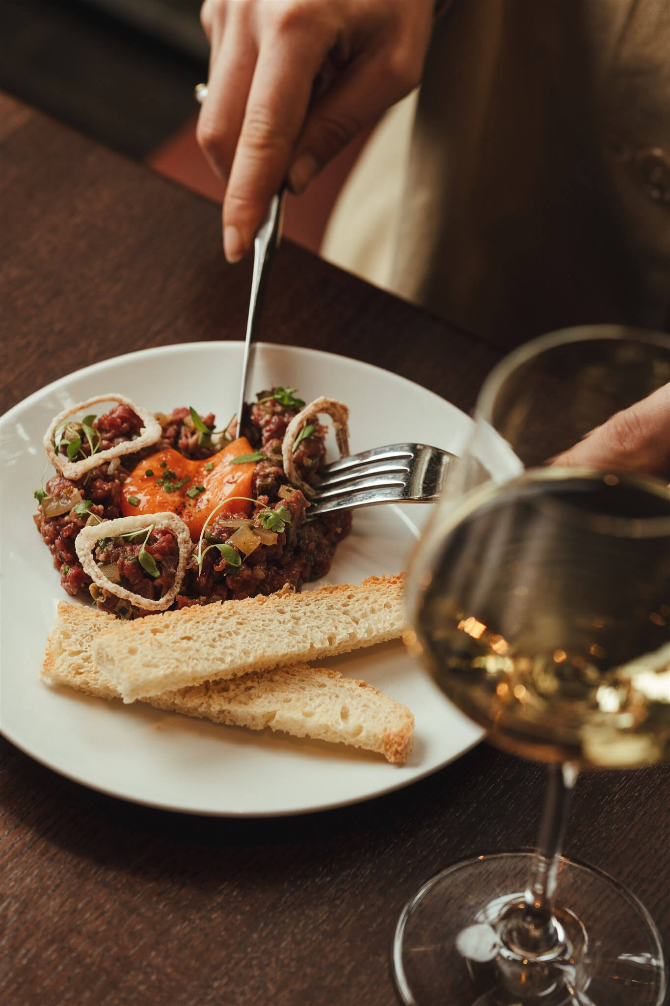Hand-cut steak tartare with toasted soldiers and white wine